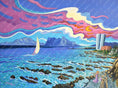 Charger l'image dans la visionneuse de la galerie, Colorful seascape painting with sailboat, rocky shore, tall buildings, and dramatic sunset clouds