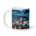Load image into Gallery viewer, White ceramic mug with a colorful village landscape and red-roofed houses under a cloudy sky