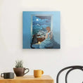 Bild in Galerie-Betrachter laden, Framed canvas art of woman and cat by window with moonlit town, above table with mugs and plant