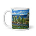 Cargar la imagen en la vista de la galería, White mug with colorful abstract landscape, ocean, green hills, clouds, and rocky cliffs design