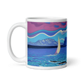 Charger l'image dans la visionneuse de la galerie, White mug with colorful beach panorama, sailboat, mountains, and vibrant sky artwork