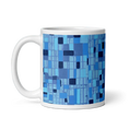 Bild in Galerie-Betrachter laden, White mug featuring blue geometric abstract art with grid and square patterns.