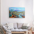 Load image into Gallery viewer, Colorful landscape canvas art of river and countryside above modern sofa in cozy living room.
