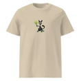 Cargar la imagen en la vista de la galería, Unisex organic cotton t-shirt in desert dust color with a cartoon dog holding a tennis racket
