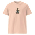 Charger l'image dans la visionneuse de la galerie, Unisex organic cotton t-shirt in light peach with black cat fishing graphic and 'Fishy Business' text.