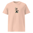 Load image into Gallery viewer, Unisex organic cotton t-shirt with cartoon dog holding tennis racket and tennis balls on peach background