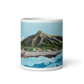 Cargar la imagen en la vista de la galería, White glossy 11 oz mug with colorful coastal mountain and ocean wave illustration