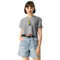 Charger l'image dans la visionneuse de la galerie, Woman wearing gray crop top with cartoon pencil and cat graphic, denim shorts, white background
