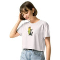 Carregar imagem no visualizador da Galeria, Woman wearing white crop top with cartoon dog and surfboard graphic, light denim jeans