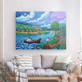 Bild in Galerie-Betrachter laden, Colorful river landscape canvas art with a man on shore and a woman rowing a boat, hanging above a sofa.