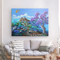 Charger l'image dans la visionneuse de la galerie, Colorful castle landscape painting with purple trees hanging above a neutral sofa in living room