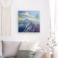 Bild in Galerie-Betrachter laden, Colorful landscape canvas art of hiker on mountain displayed in modern living room decor