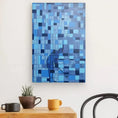 Charger l'image dans la visionneuse de la galerie, Modern wall art of golfer putting, blue geometric canvas above a table with mugs and plant